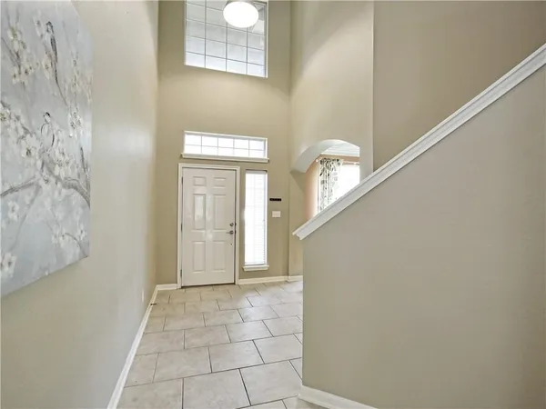 a view of a hallway with entryway door