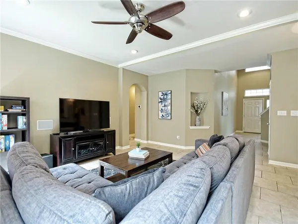 a living room with furniture and a flat screen tv