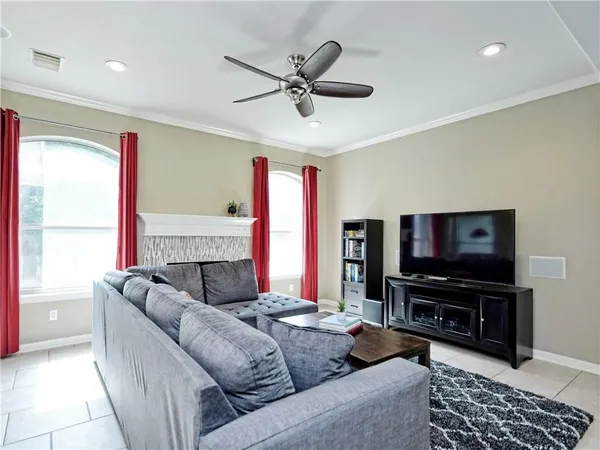 a living room with furniture and a flat screen tv