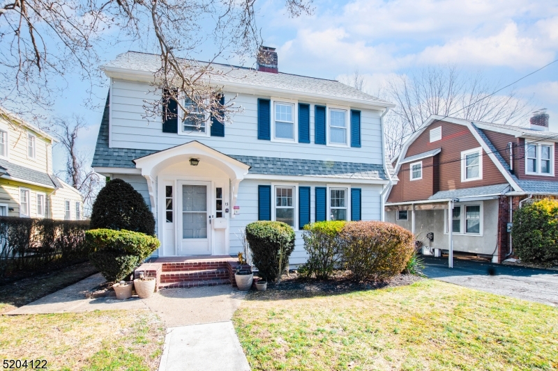 13 Clark Street Summit, NJ 07901 - Photo 1 of 24 a front view of a house with a yard outdoor seating and covered with trees