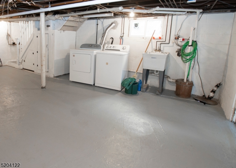 13 Clark Street Summit, NJ 07901 - Photo 18 of 24 a utility room with dryer and washer
