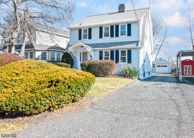 13 Clark Street Summit, NJ 07901 - Photo 2 of 24 a front view of a house with a yard