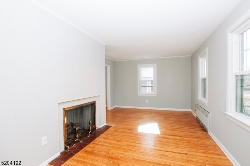 13 Clark Street Summit, NJ 07901 - Photo 3 of 24 a view of an empty room with window and fire place