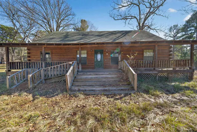 a view of a house with a small yard