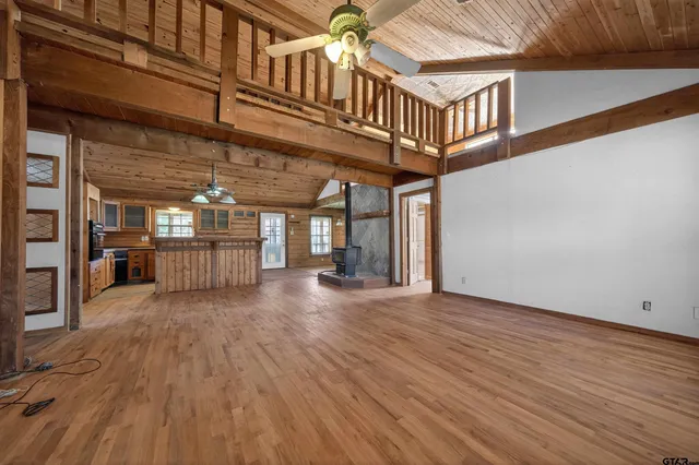 a view of a balcony with wooden floor