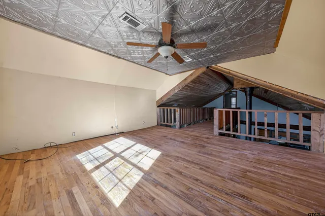 a view of outdoor space with wooden floor