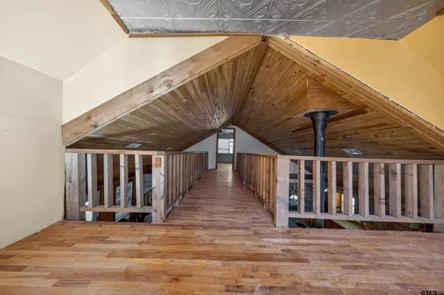 a bathroom with a toilet sink and shower curtain