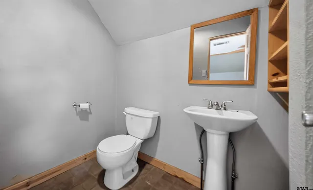 a bathroom with a toilet and a sink