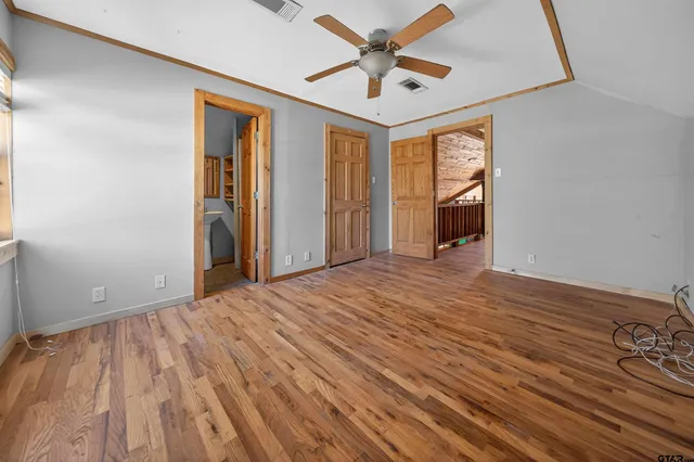 a view of a wooden deck with a yard