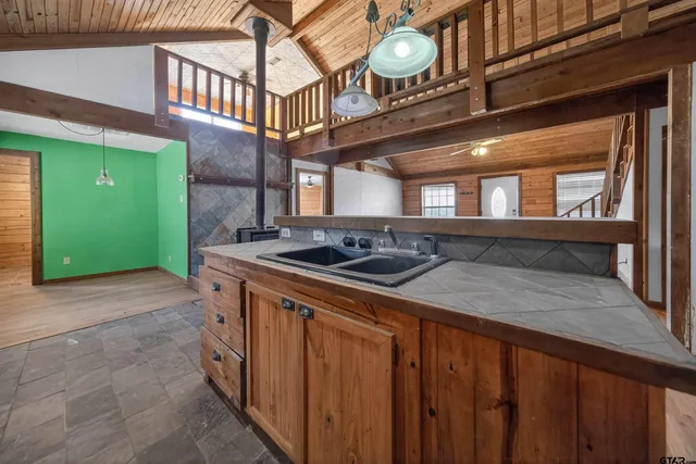 a kitchen with a sink and cabinets