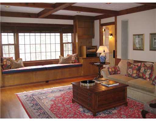 Family Room. Lovely family room with sparkling hardwood floors, gas/log fireplace, large window seat,built-in bookshelves and built-in speakers.Great for entertaining with flow thru doors to screen porch and living room.