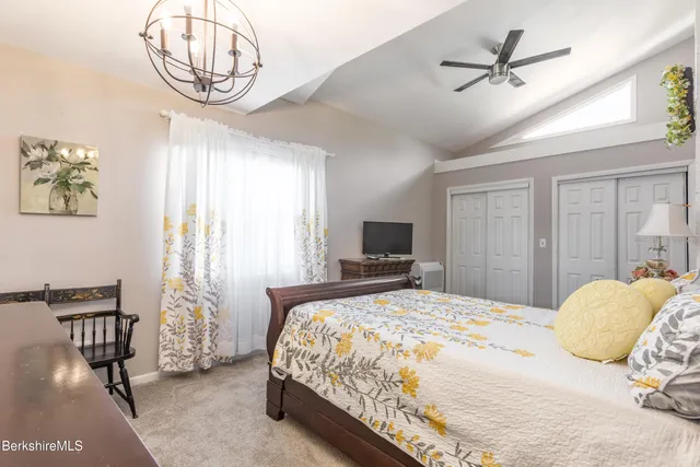 a bathroom with a granite countertop sink a shower and a mirror