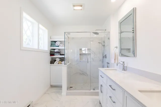 a bath room with a sink a toilet and a tub