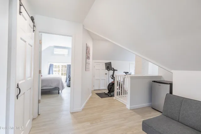 a yellow house with trees in front of it