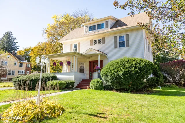 a view of swimming pool with outdoor seating and plants