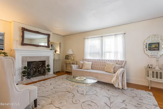 a view of a large kitchen with furniture and a window