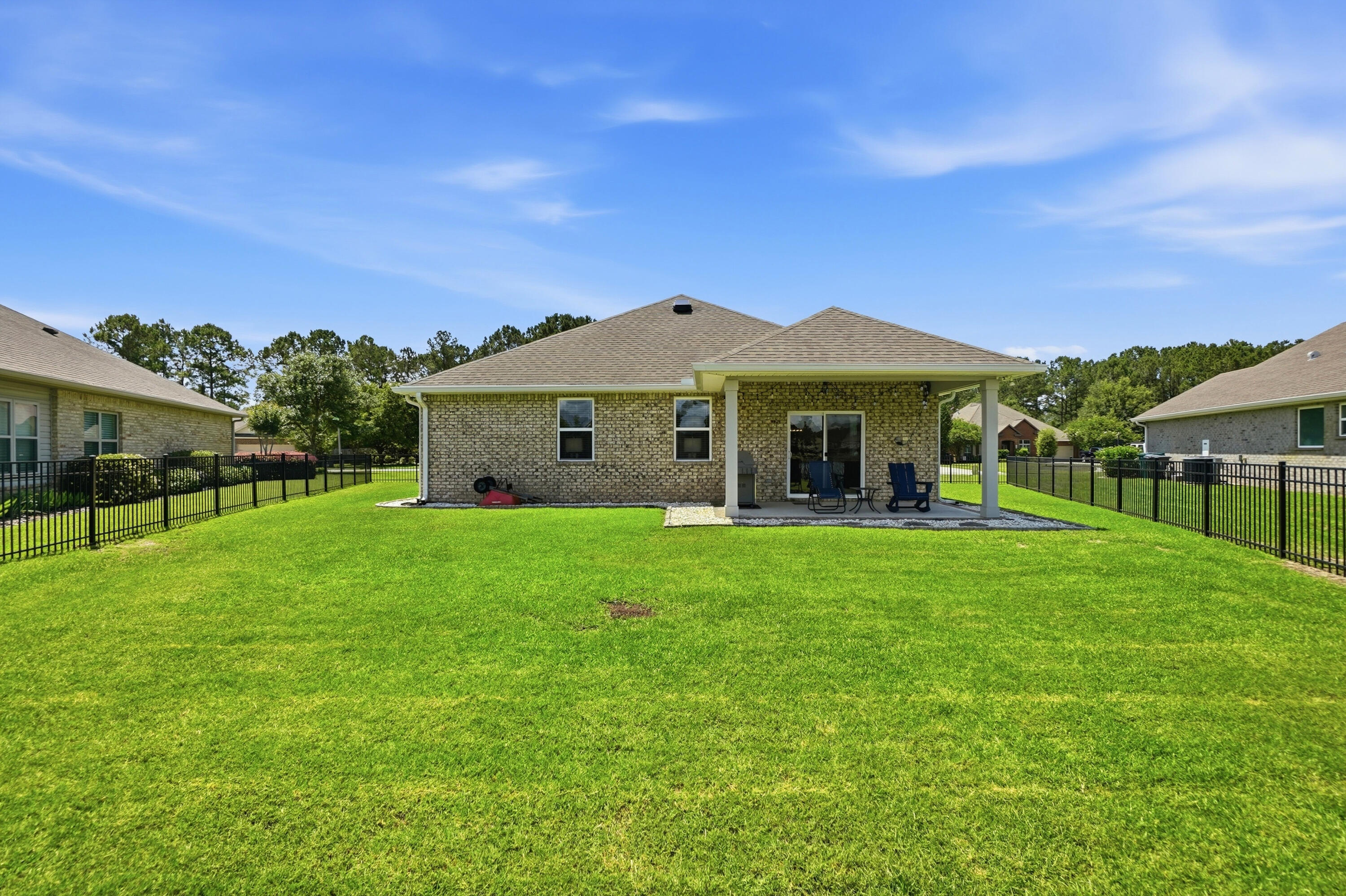 525 Windchime Way Freeport, FL 32439 - Photo 37 of 59 a view of a house with a backyard