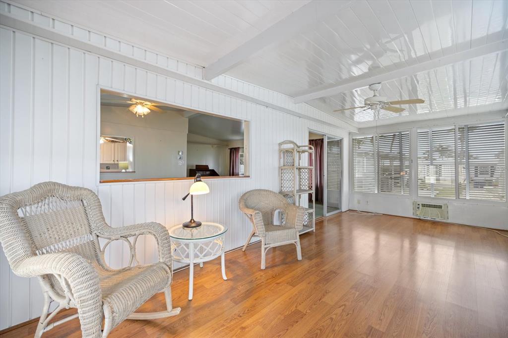 5791 Orange Blossom Road Venice, FL 34293 - Photo 12 of 55 a living room with furniture and wooden floor