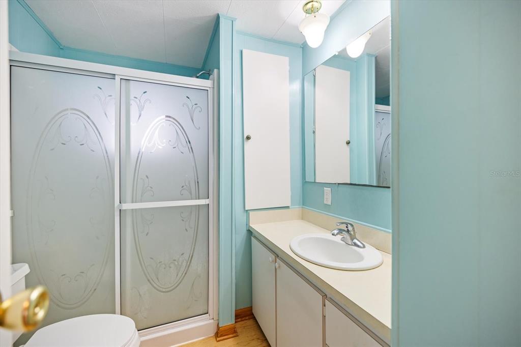 5791 Orange Blossom Road Venice, FL 34293 - Photo 20 of 55 a bathroom with a sink a toilet and shower