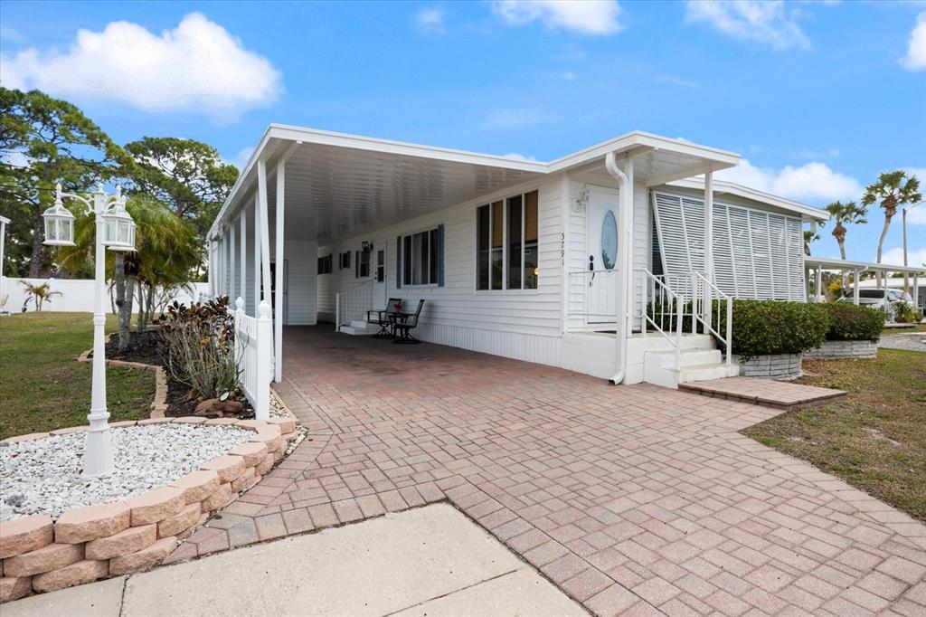 5791 Orange Blossom Road Venice, FL 34293 - Photo 35 of 55 a front view of a house with a yard