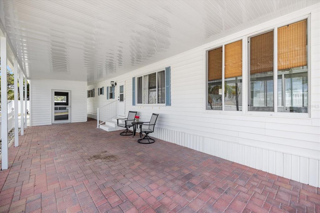 5791 Orange Blossom Road Venice, FL 34293 - Photo 39 of 55 a view of a livingroom with a lounge chair and a large window
