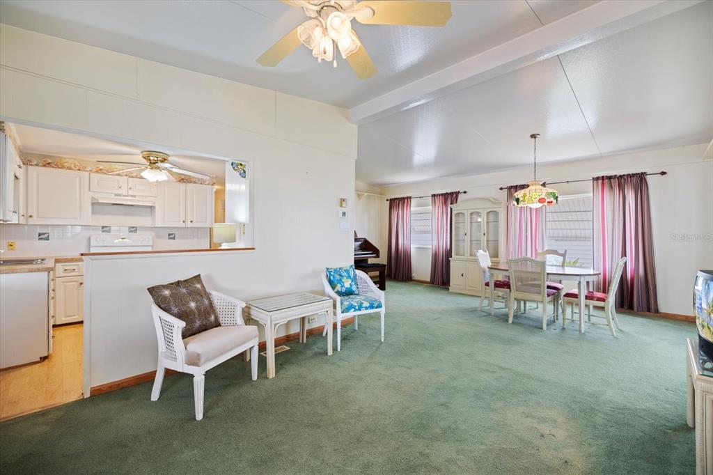 5791 Orange Blossom Road Venice, FL 34293 - Photo 6 of 55 a view of a dining room with furniture and chandelier