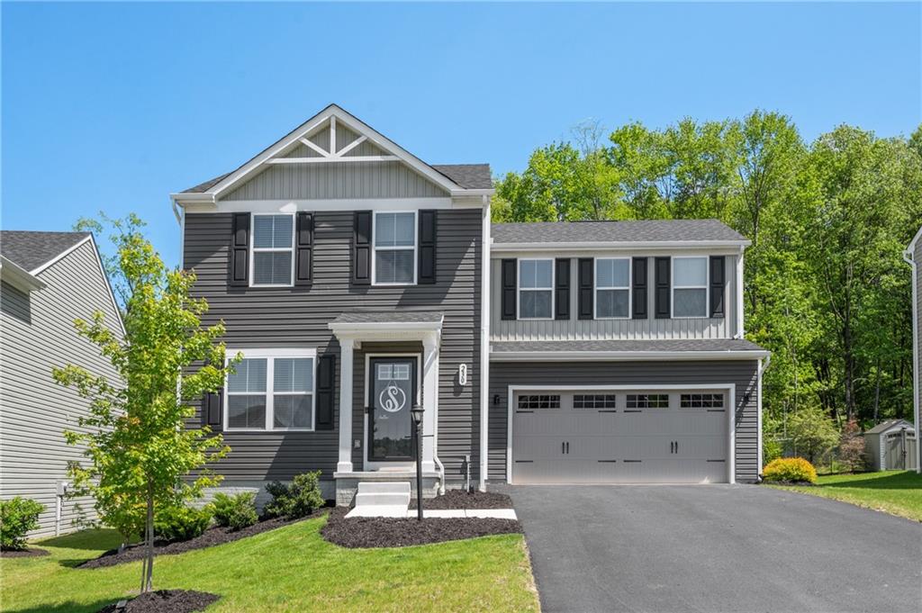 230 James Patrick Place Zelienople, PA 16063 - Photo 1 of 34 a front view of a house with garden