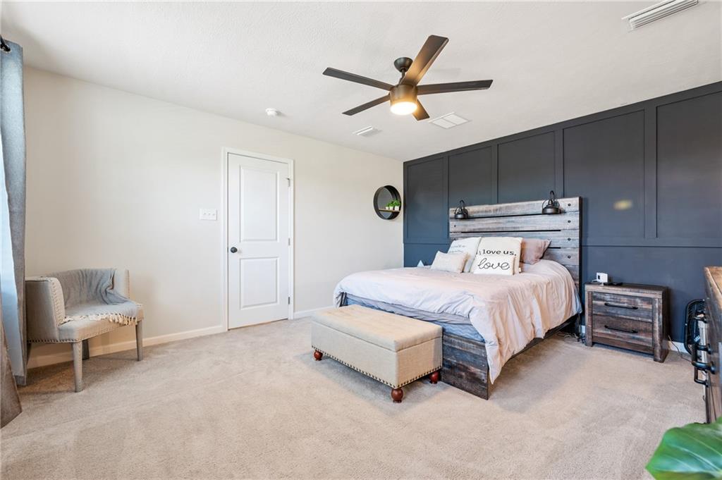 230 James Patrick Place Zelienople, PA 16063 - Photo 14 of 34 a spacious bedroom with a bed and a chandelier