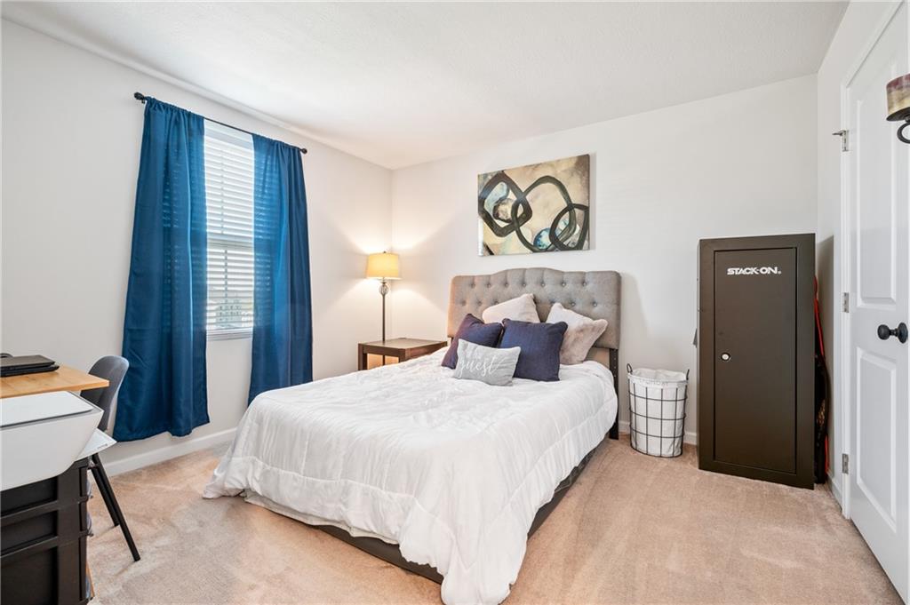 230 James Patrick Place Zelienople, PA 16063 - Photo 17 of 34 a bedroom with a bed and a table in it