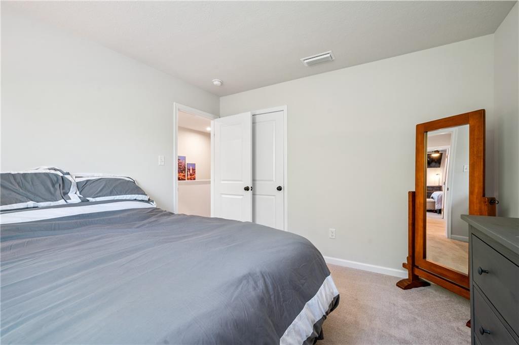 230 James Patrick Place Zelienople, PA 16063 - Photo 20 of 34 a bedroom with a bed and cabinets