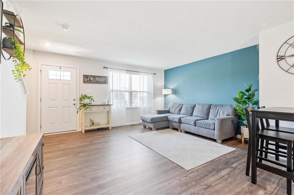 230 James Patrick Place Zelienople, PA 16063 - Photo 2 of 34 a living room with furniture and a wooden floor