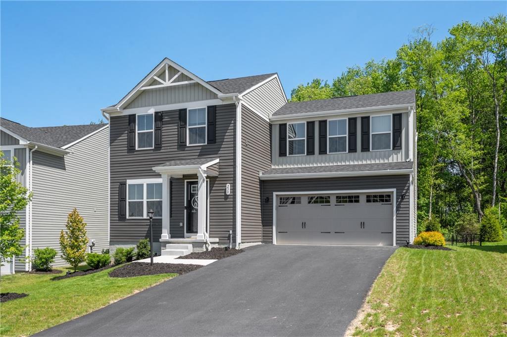 230 James Patrick Place Zelienople, PA 16063 - Photo 30 of 34 a front view of a house with a yard and garage