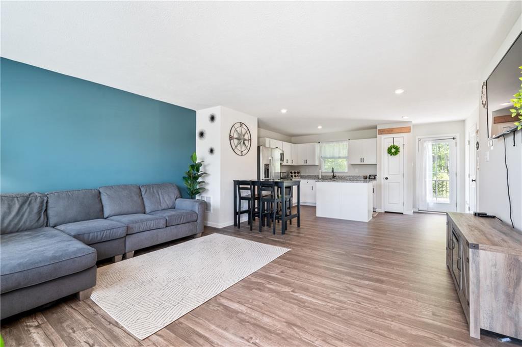 230 James Patrick Place Zelienople, PA 16063 - Photo 3 of 34 a living room with furniture and kitchen view with wooden floor