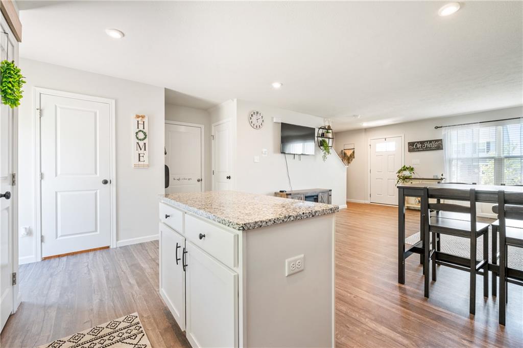 230 James Patrick Place Zelienople, PA 16063 - Photo 10 of 34 a kitchen with granite countertop a table and chairs in it