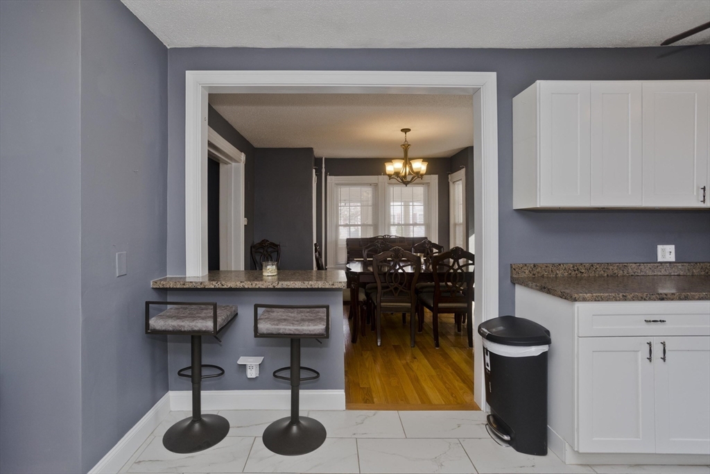 60 Mill Street Westfield, MA 01085 - Photo 14 of 42 a kitchen with a sink and a stove
