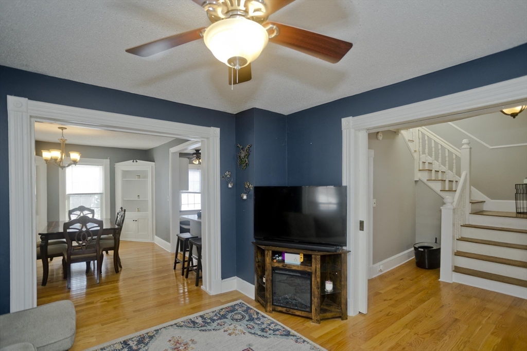 60 Mill Street Westfield, MA 01085 - Photo 23 of 42 a living room with furniture and a flat screen tv