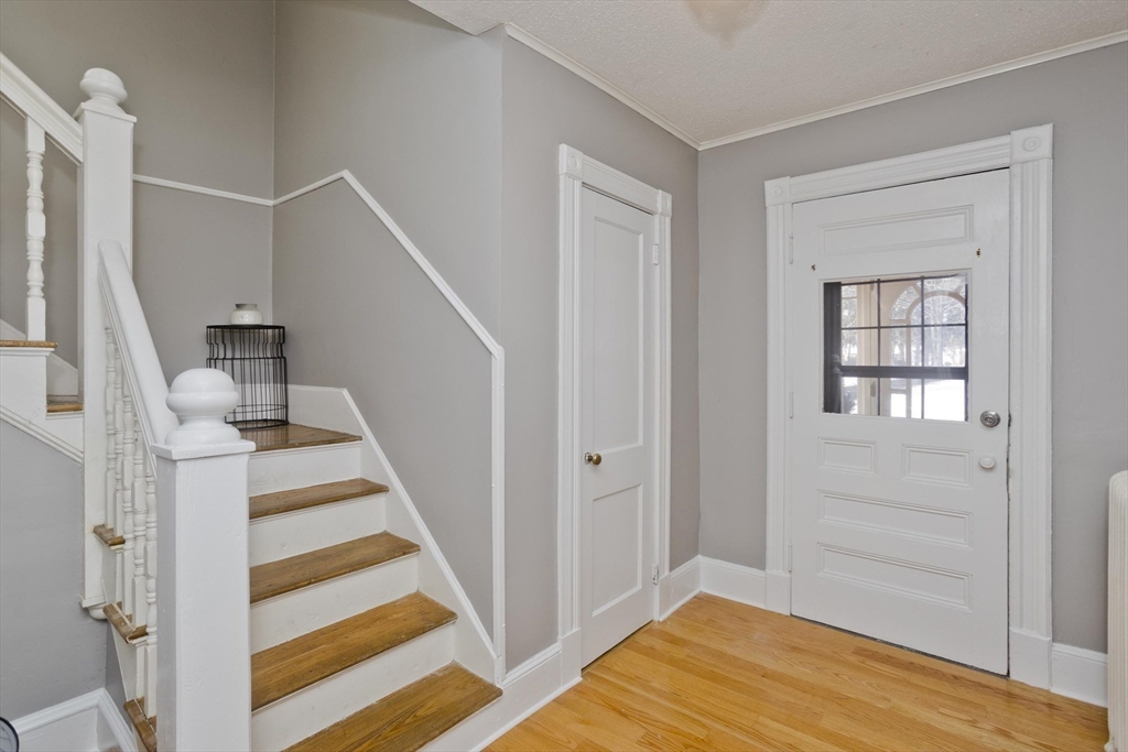 60 Mill Street Westfield, MA 01085 - Photo 24 of 42 a view of entryway with wooden floor and stair