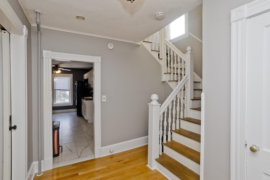 60 Mill Street Westfield, MA 01085 - Photo 25 of 42 a view of entryway and hall with wooden floor