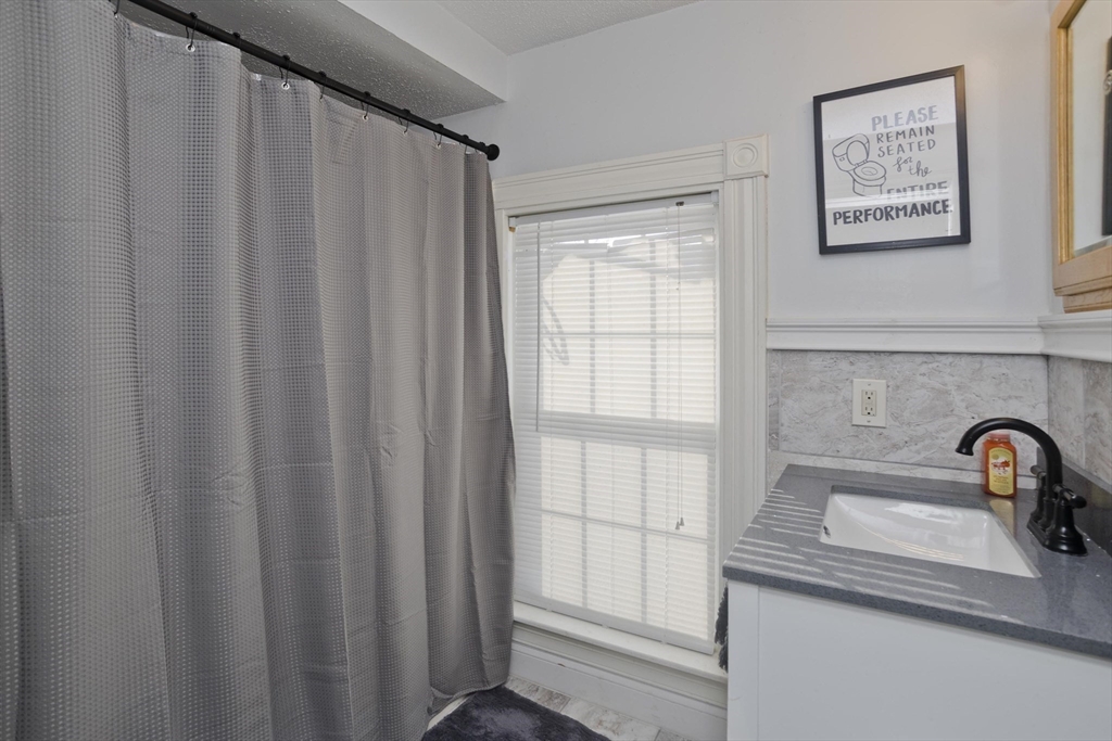 60 Mill Street Westfield, MA 01085 - Photo 36 of 42 a close view of a sink and a window