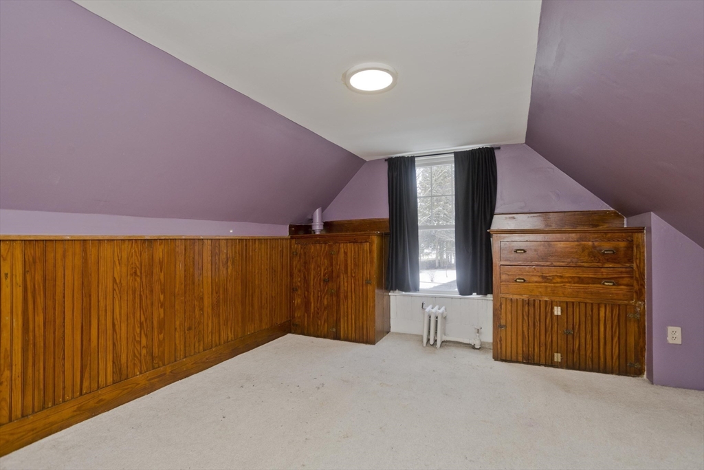 60 Mill Street Westfield, MA 01085 - Photo 37 of 42 a bed room with a bed and mirror