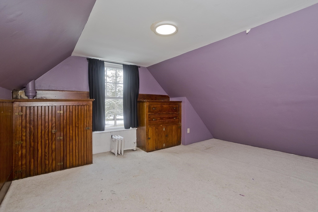 60 Mill Street Westfield, MA 01085 - Photo 38 of 42 a view of an empty room with wooden floor and a window
