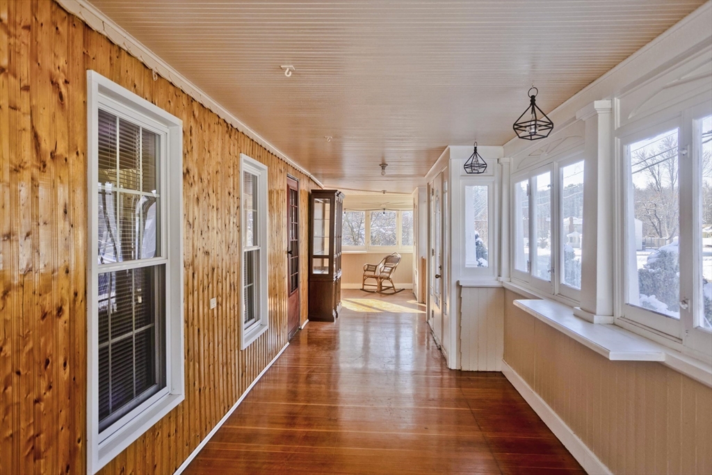 60 Mill Street Westfield, MA 01085 - Photo 9 of 42 a view of an entryway with wooden floor and windows