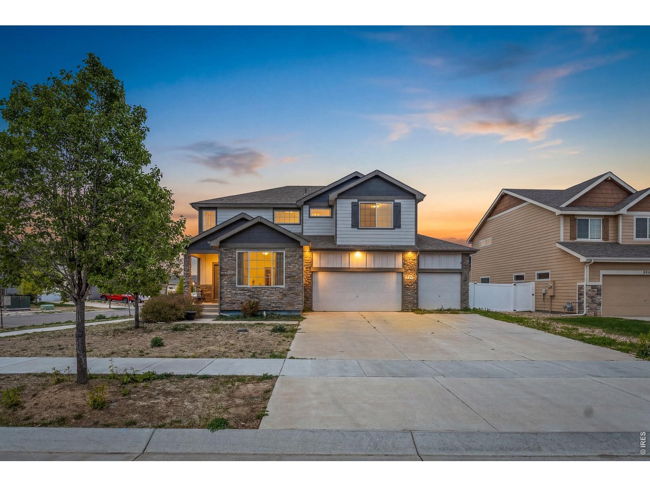 8847 16th St Road Greeley, CO 80634 - Photo 1 of 38 a front view of a house with a yard