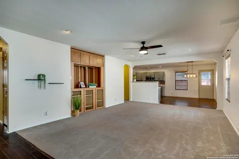a view of livingroom with hardwood floor and a ceiling fan