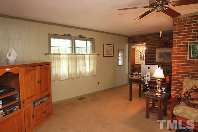 4616 Waterbury Road Raleigh, NC 27604 - Photo 7 of 12 a view of a livingroom with furniture and windows