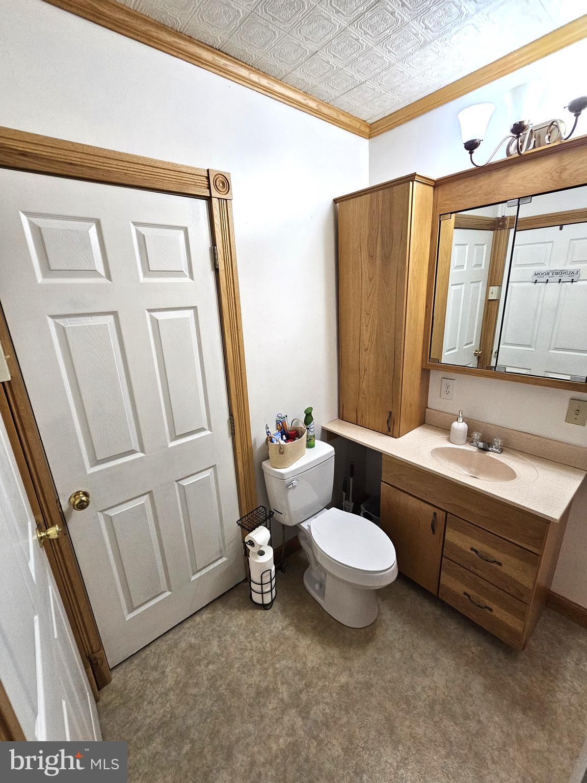 75 King Street Milroy, PA 17063 - Photo 16 of 19 a bathroom with a sink a toilet a mirror and shower