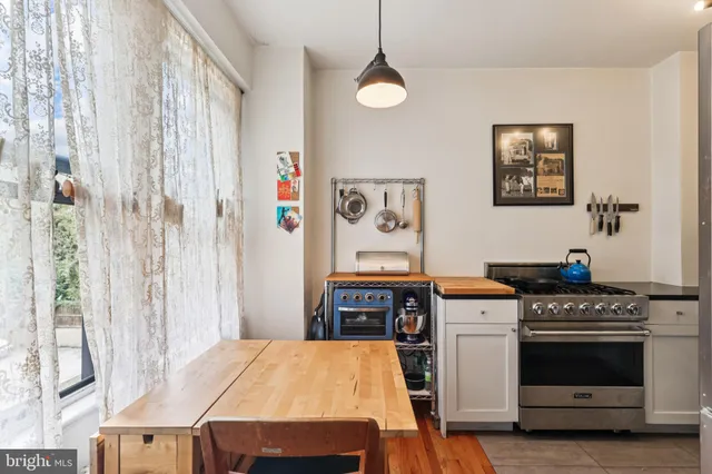 a kitchen with a stove and a refrigerator
