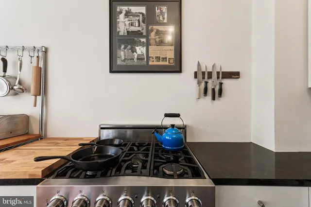 storage and a stove sitting inside of a kitchen