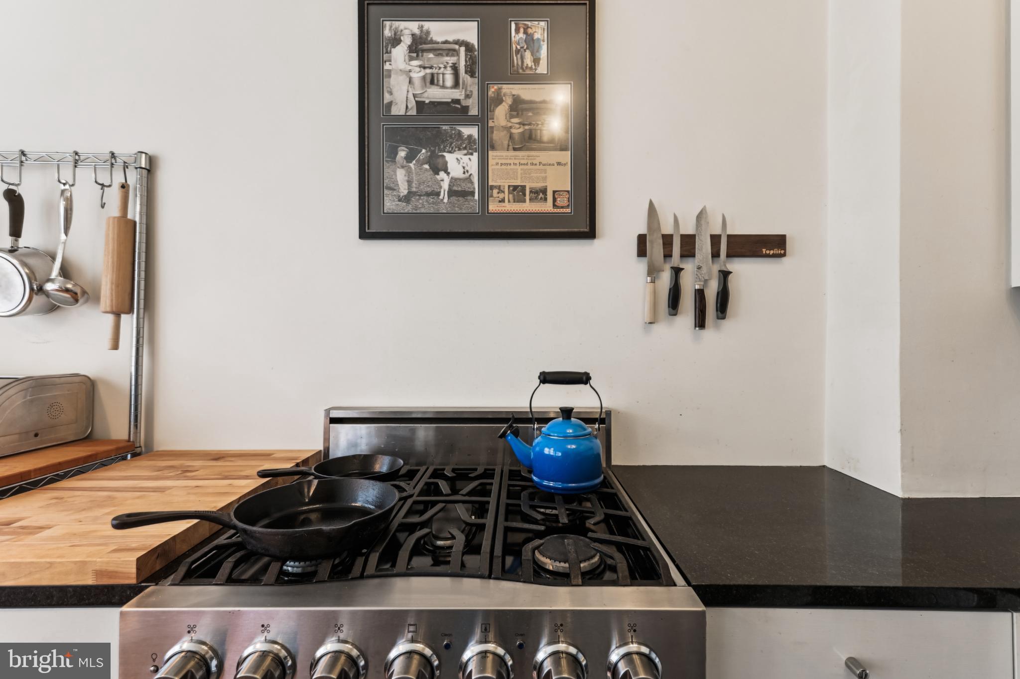 1365 Kennedy Street Northwest, Unit 209 Washington, DC 20011 - Photo 15 of 35 storage and a stove sitting inside of a kitchen