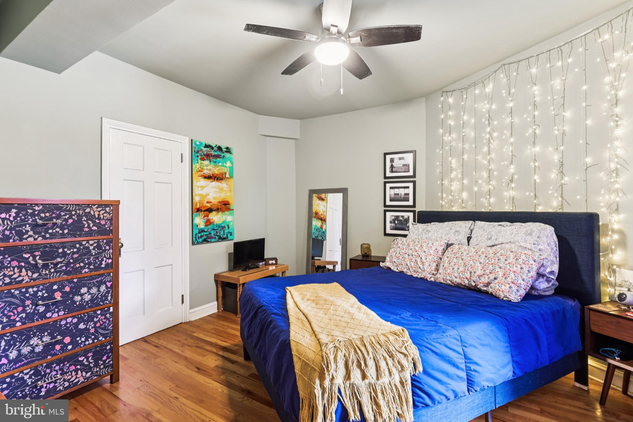 1365 Kennedy Street Northwest, Unit 209 Washington, DC 20011 - Photo 19 of 35 a bedroom with a bed and a chandelier